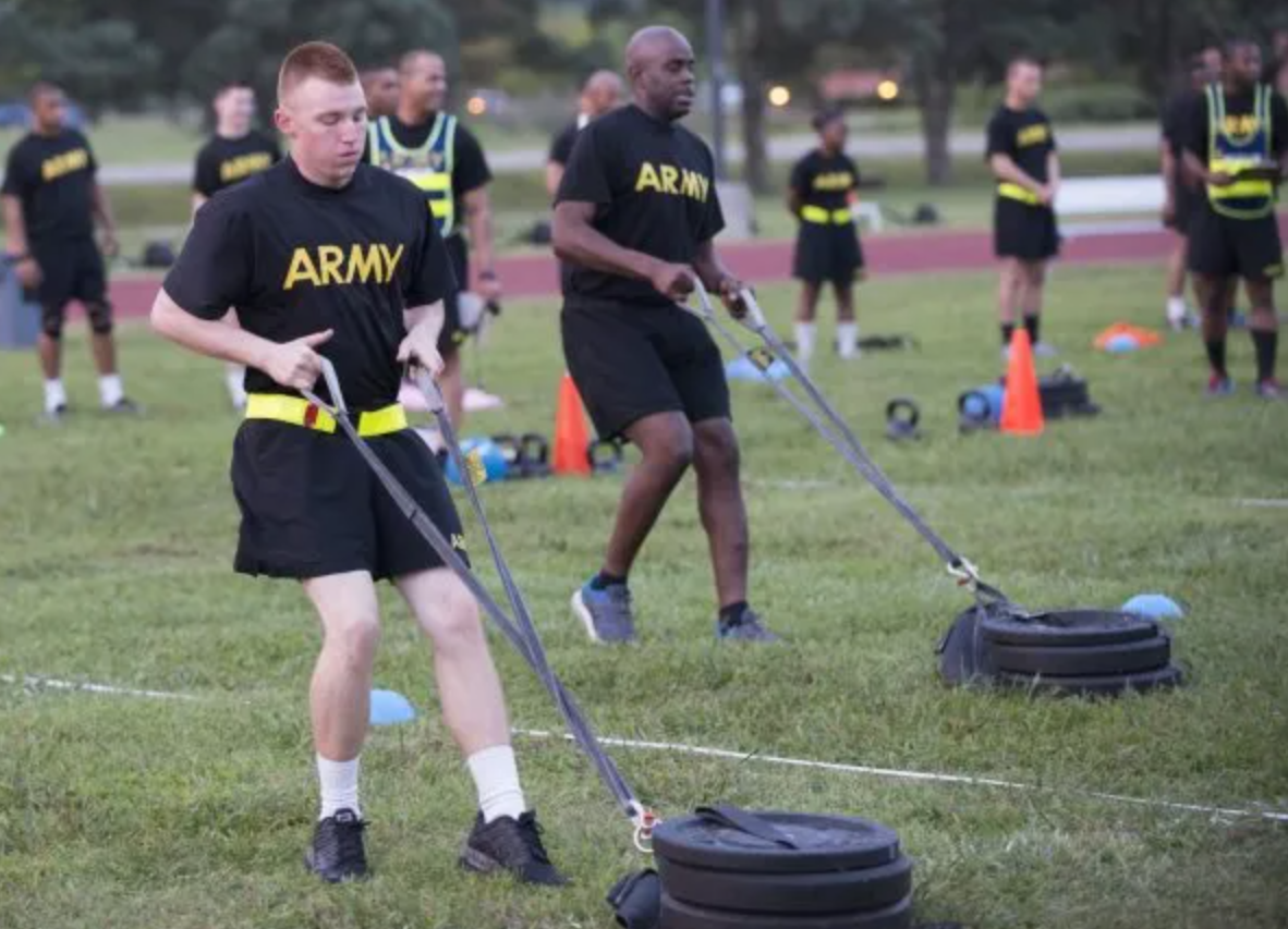 Army soldier dragging 90-pound sled during Sprint-Drag-Carry event at ACFT